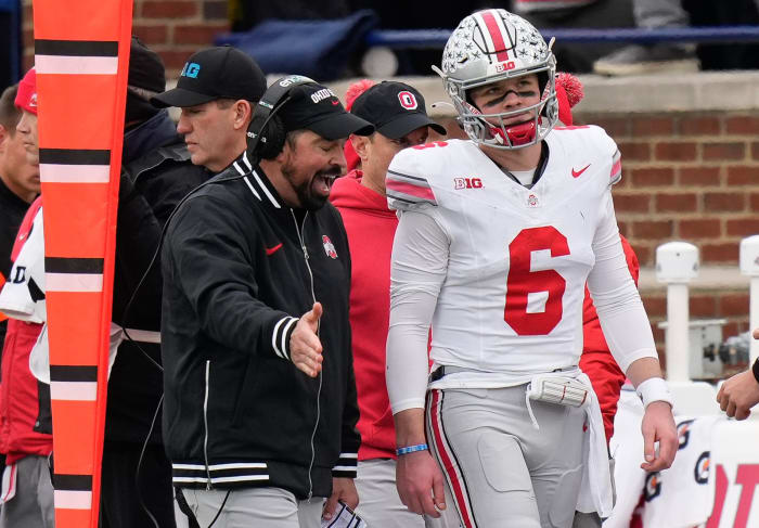 Ohio State Buckeyes Kyle McCord and Ryan Day on the sidelines during Saturday's matchup against Michigan at Michigan Stadium in Ann Arbor